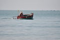 Vietnamese fisher fishing in Mui Ne, Vietnam Royalty Free Stock Photo